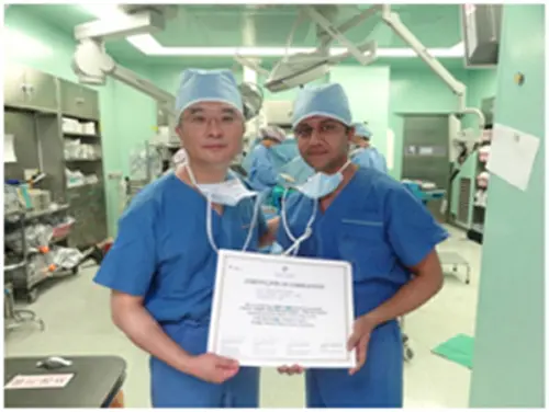 Dr. Dhaval Sagala with colleague holding certificate of completion